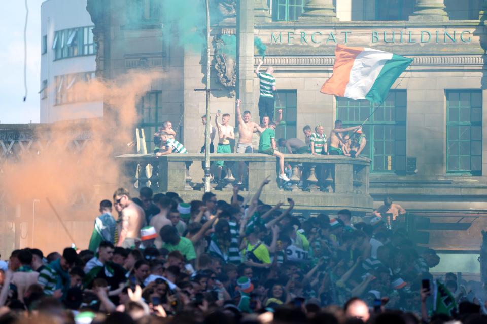 Celtic fans celebrating a premiership win in Glasgow.