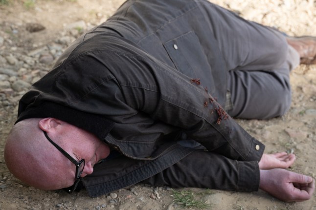 Paddy lays on the floor after being attacked in Emmerdale