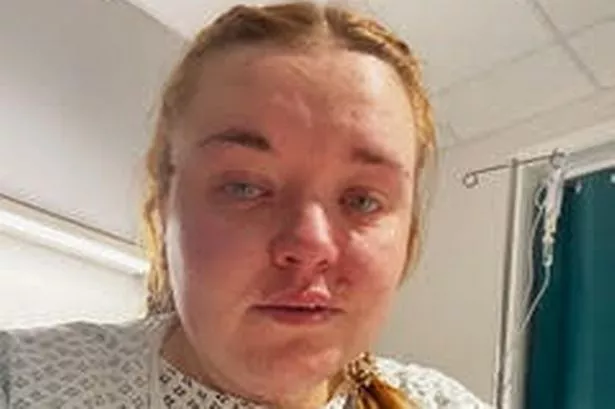 Tyanne in a hospital gown crying