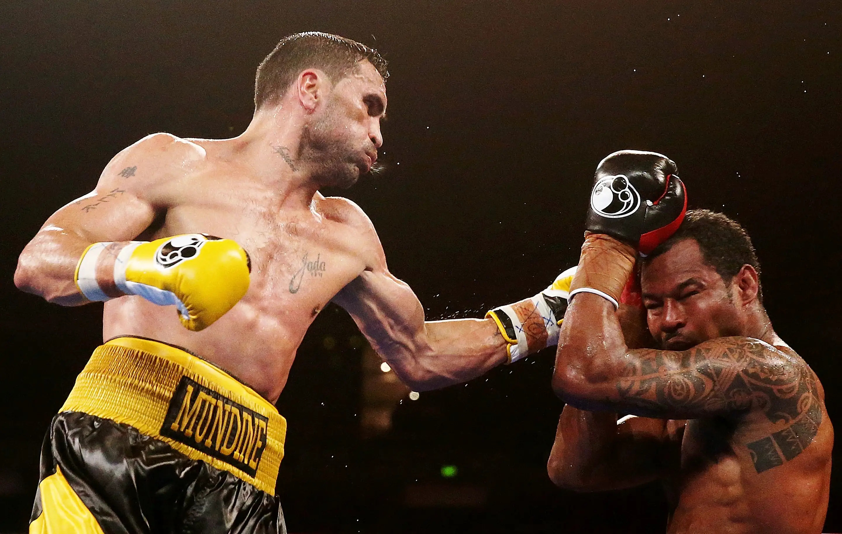 SYDNEY, AUSTRALIA - NOVEMBER 27:  Anthony Mundine lands a left on Shane Mosley during the WBA International super welterweight title bout between Anthony Mundine and Shane Mosley at Acer Arena on November 27, 2013 in Sydney, Australia.  (Photo by Mark Metcalfe/Getty Images)