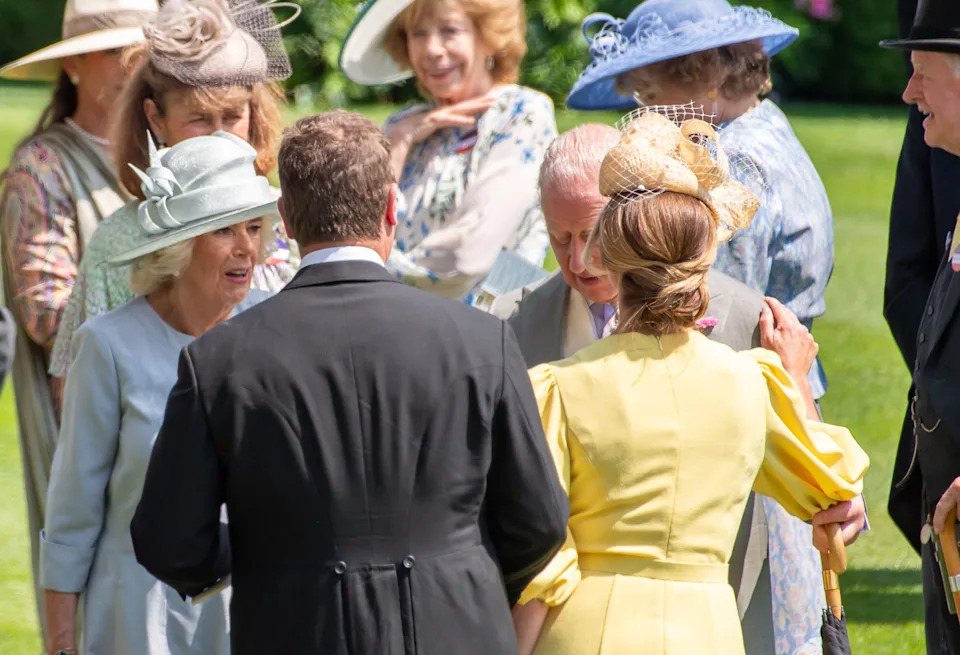 Harriet Sperling kissing King Charles at Royal Ascot, with Queen Camilla and Peter Phillips watching on