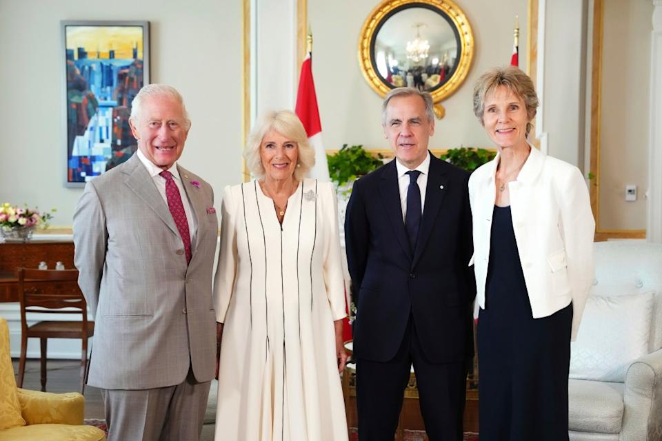 King Charles, Queen Camilla, Mark Carney and his wife pose for a photo