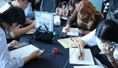 International students fill in application forms at a job fair held in Busan on Sept. 27, 2024. [YONHAP]