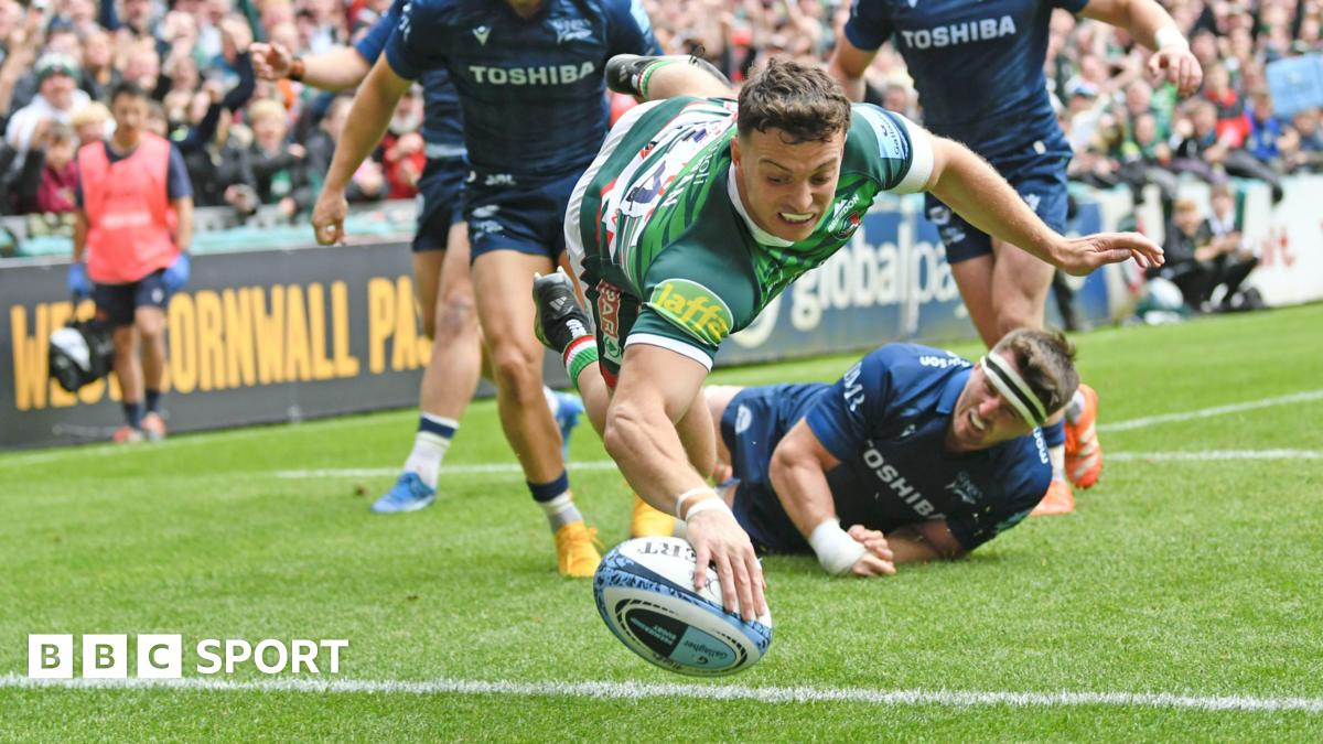 Adam Radwan dives over for his first try against Sale Sharks