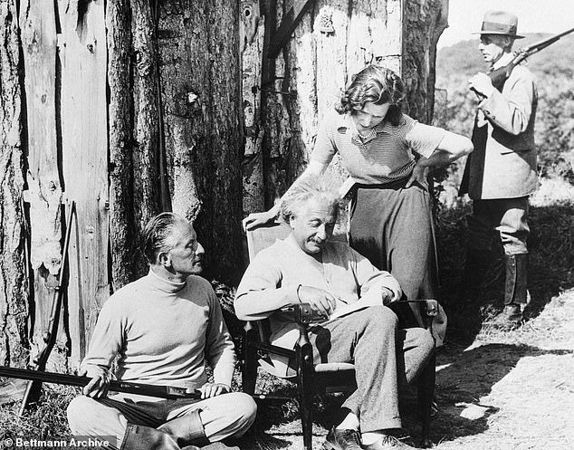 A fascinating letter by Albert Einstein revealing how he was enjoying the 'enviable solitude' of Norfolk while in hiding from the Nazis has emerged 92 years on. The physicist stayed in a cabin as the guest of Conservative MP Oliver Lampson. Above: Einstein outside the cabin with Locker-Lampson and an armed guard