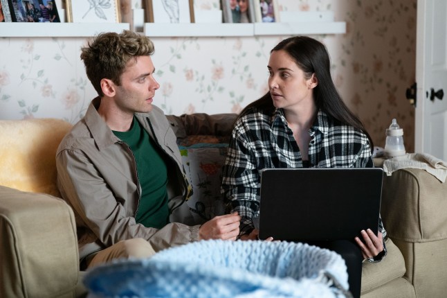 Peter and Lauren sit on a sofa and talk in EastEnders