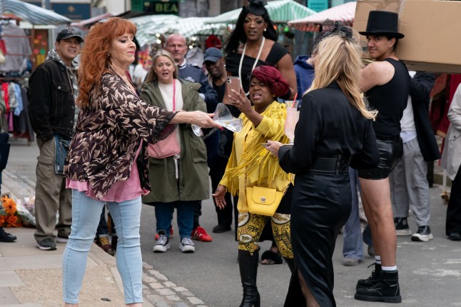 Elaine throws a drink over Cindy as Kim films it in EastEnders