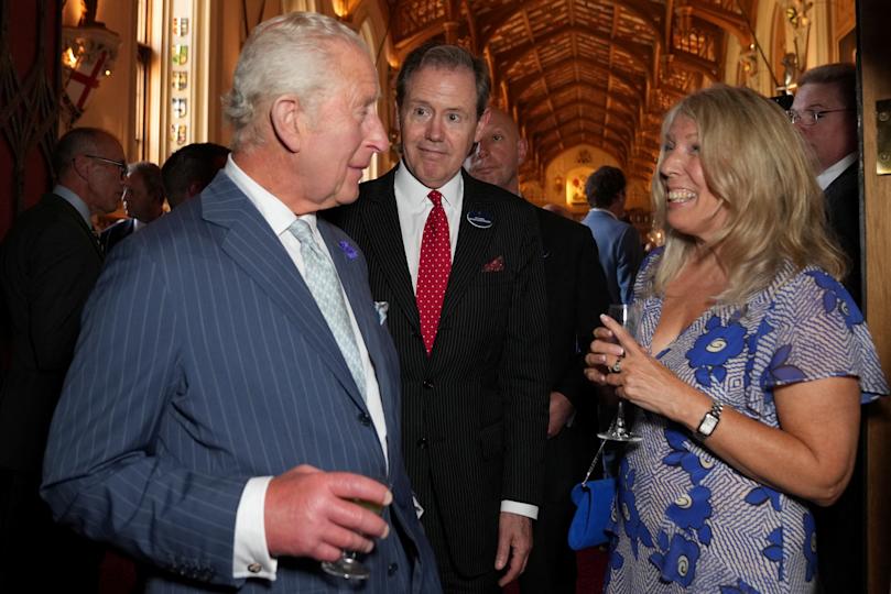 King Charles III speaks with Lisa Kay of footwear company Sole Bliss Ltd at reception for the King's Award for Enterprise at Windsor Castle on June 12, 2025