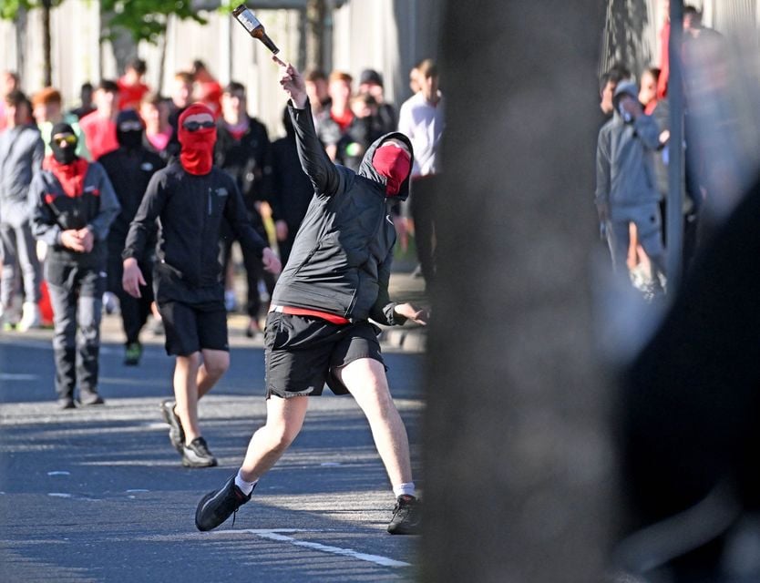 Bottles thrown at police lines during disorder at Broadway. (Pic: Alan Lewis - PhotopressBelfast.co.uk)