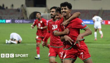Oman celebrate a goal