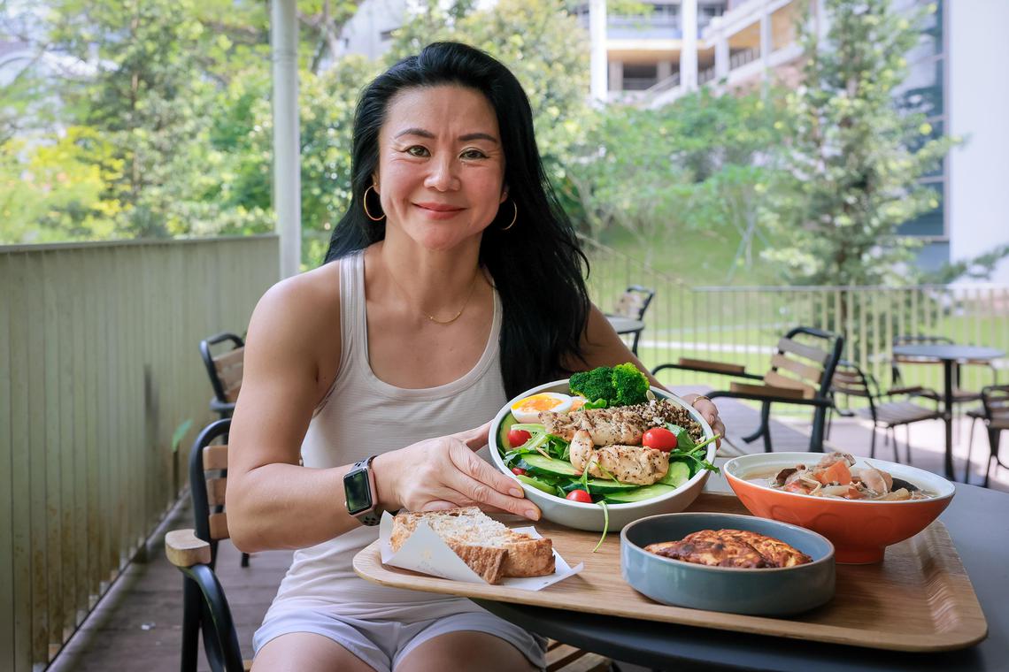 The Soup Spoon founder Anna Lim with meals that she usually eat at her restaurant in NUS Central Library on June 11, 2025.