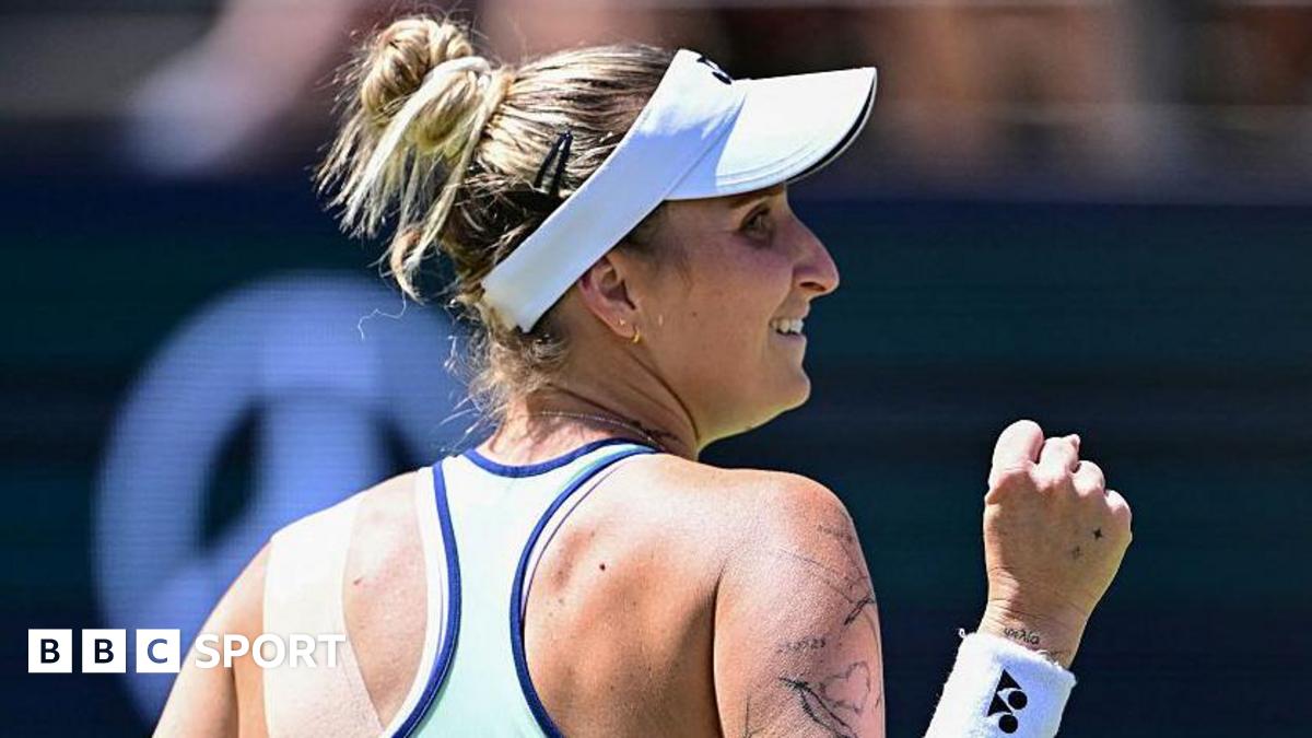 Marketa Vondrousova holds up her fist