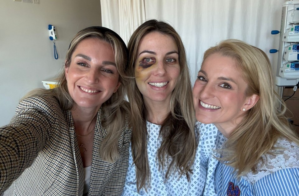 Three women in a hospital room, one with a black eye.