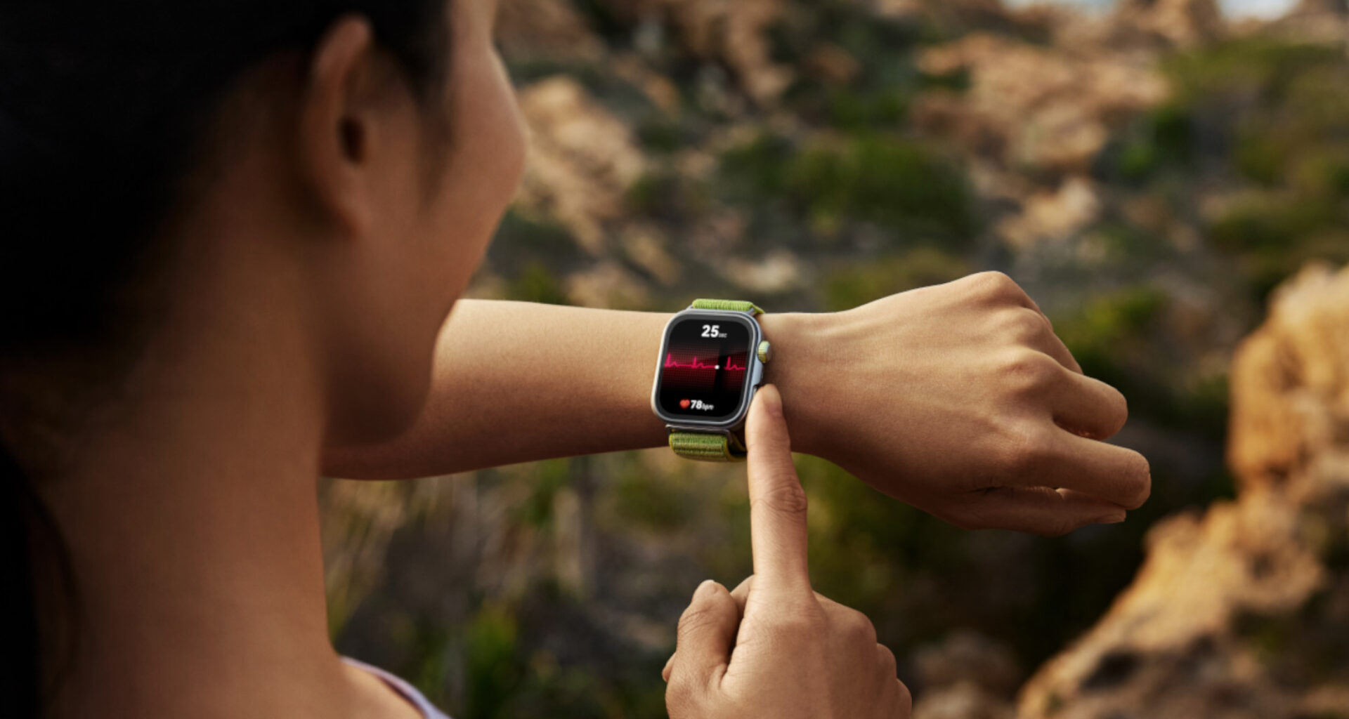 Image of a woman pressing a button on the side of the Huawei Watch Fit Pro 4 smartwatch