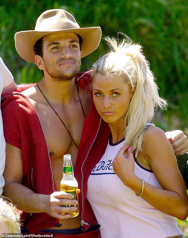 Katie went on to strike up a romance with her now ex-husband Peter Andre during their time together on the ITV reality show wit Scott threatening to 'punch his lights out' (pictured 2004)