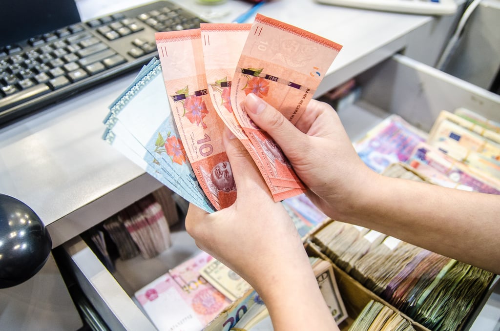 Malaysians face higher costs for goods and homes due to new government taxes. Photo: Shutterstock