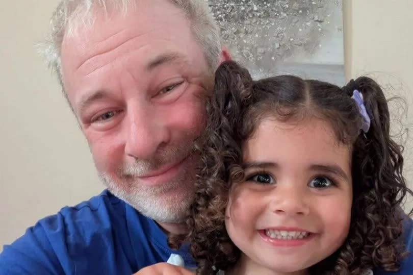 Paul Barnett, 47, with his three-year-old granddaughter Suraiya