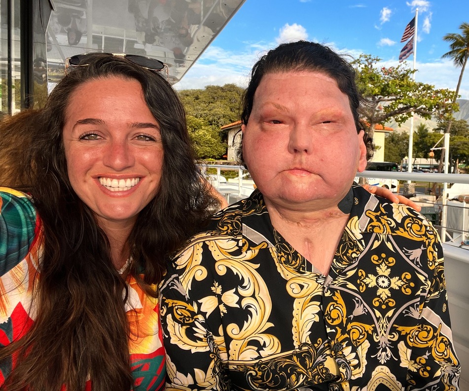 A woman and her boyfriend pose for a selfie.