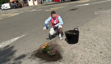 Harry Smith-Haggett with his 'Pretty Pot Holes' hi vis.