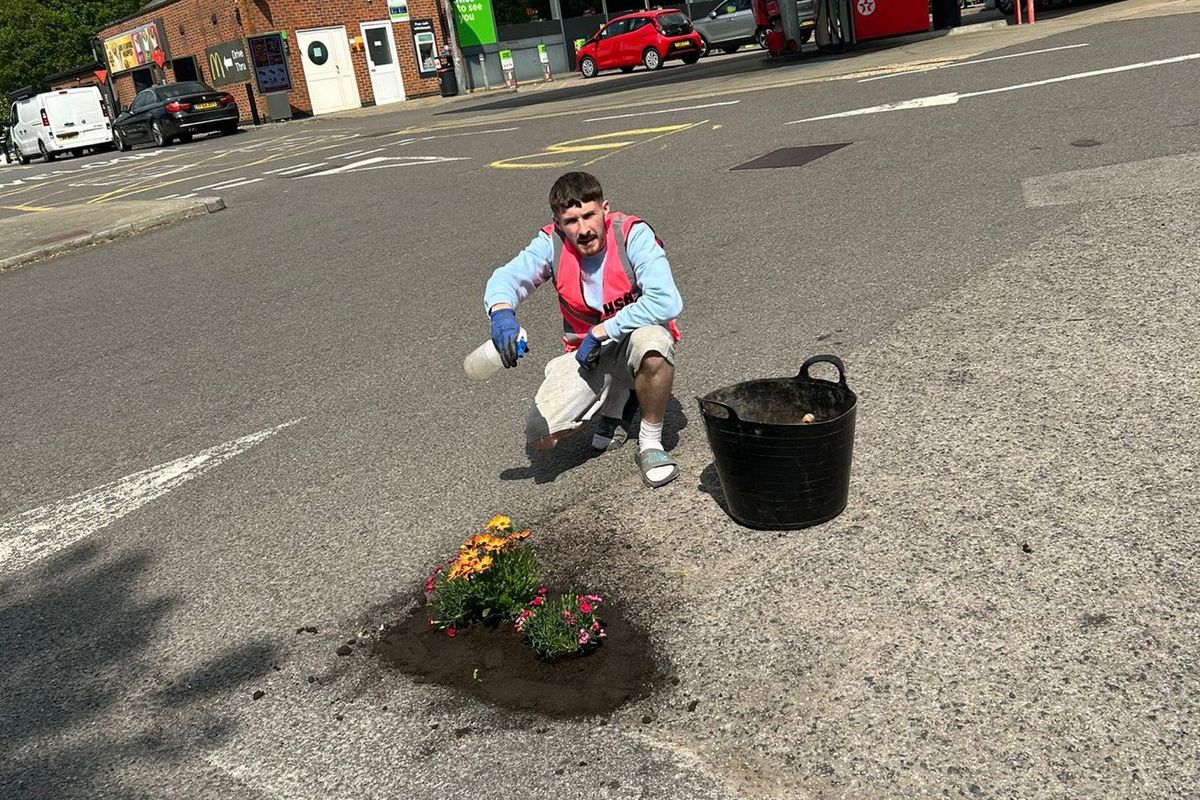Harry Smith-Haggett with his 'Pretty Pot Holes' hi vis.