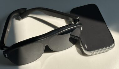 Rokid AR glasses in black alongside an external YodaOS-Master OS controller