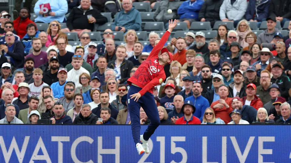 England's Will Jacks jumps in the air as he attempts to take a catch in the T20 international between England and the West Indies in Bristol. Behind him a packed stand is full of people watching his attempt