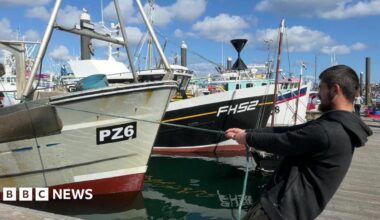 A man pulling a fishing boat
