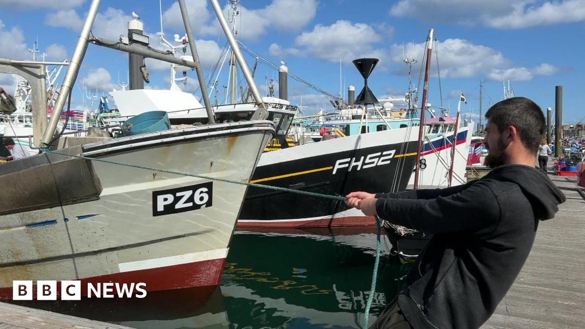 A man pulling a fishing boat