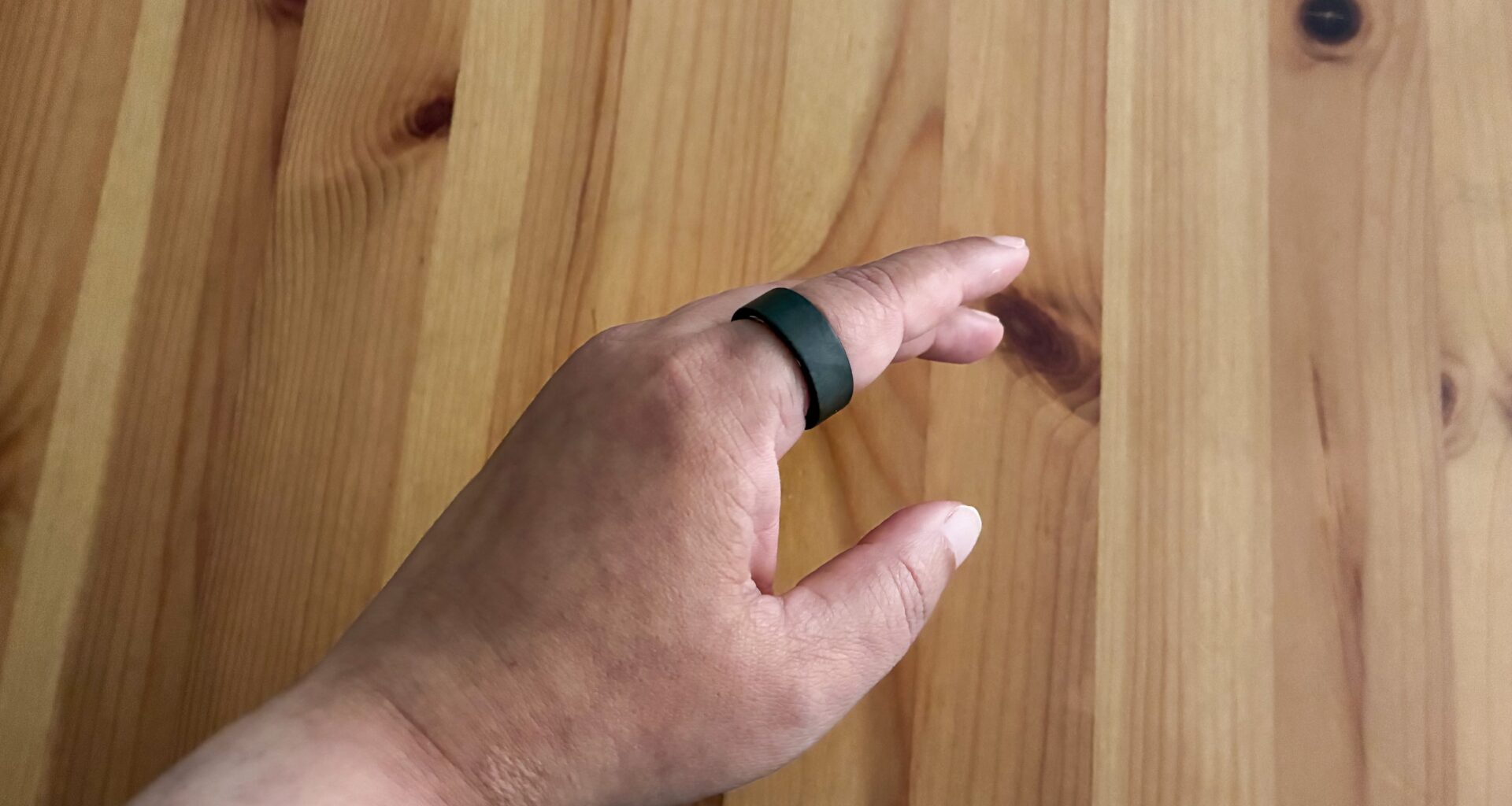 The Ultrahuman Ring Air on an index finger