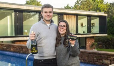 Omaze winners Lauren Keene and Ryan Mitchell outside their home on the Wirral, which they won in the prize drawn in December