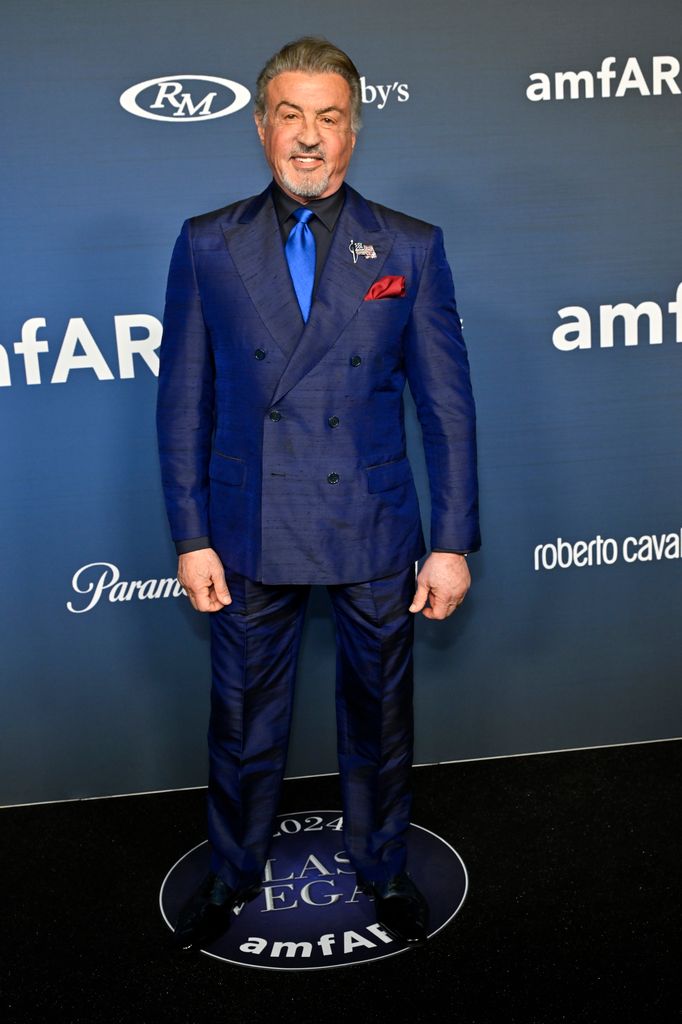 Sylvester Stallone in a blue shirt and suit