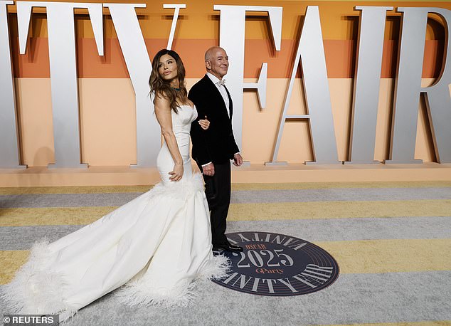 In another set of photos, the star posed with Bezos, as she lovingly locked arms with the businessman, who was black velvet suit