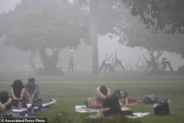 Air pollution created by burning fossil fuels is responsible for approximately 8.34 million deaths every year. Pictured: New Delhi enveloped by morning smog