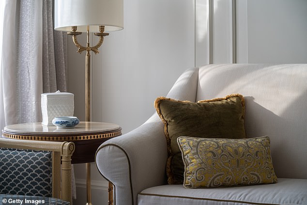 To get the princess's living room look, pair cream sofas with bold, patterned cushions