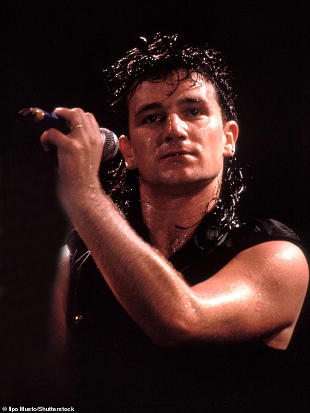 Bono was a globe-trotting sex symbol selling out stadiums with his signature all-black outfits and tinted sunglasses—an edgy look that became his trademark; (seen in 1986)