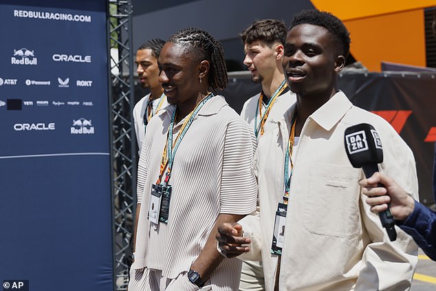 Bukayo Saka (right) briefly chatted to DAZN during a stroll with his England team-mates