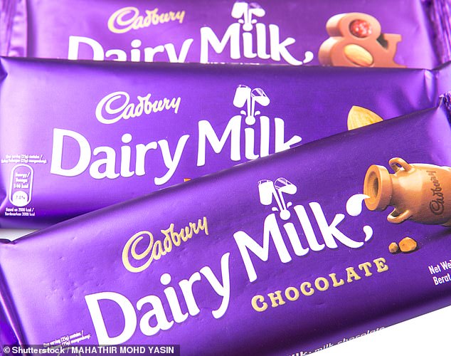 Counting its profits: More than 70 MPs and peers have accused Cadbury owner of 'funding Russia's war machine' by continuing to trade in the country