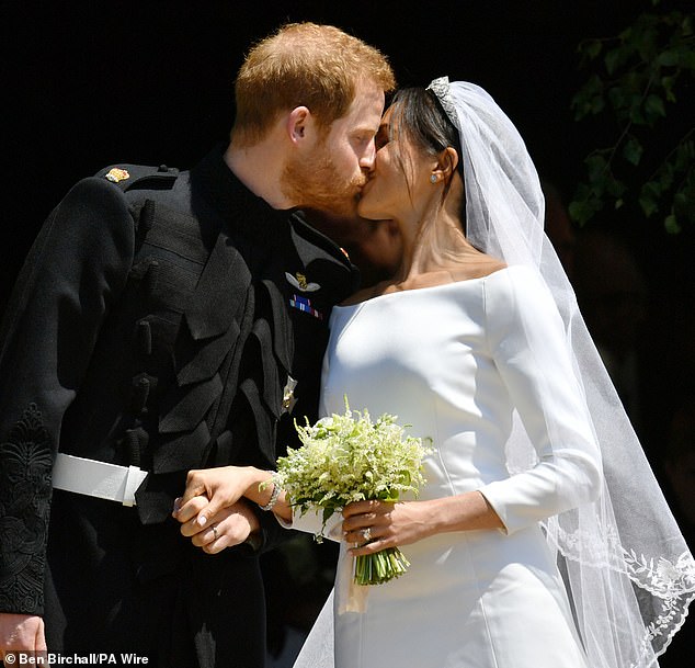 Prince Harry and Meghan kiss outside St George's Chapel on their wedding day.  It was the celebrity event of the year when the couple said 'I do' in May 2018