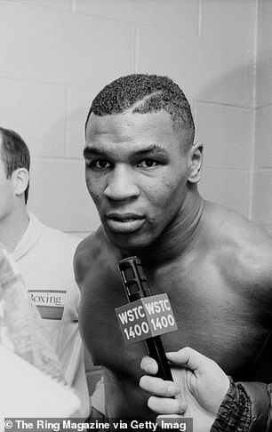Mike Tyson talks to the press after winning the fight against Sammy Scaff during the bout at the Felt Forum on December 6, 1985