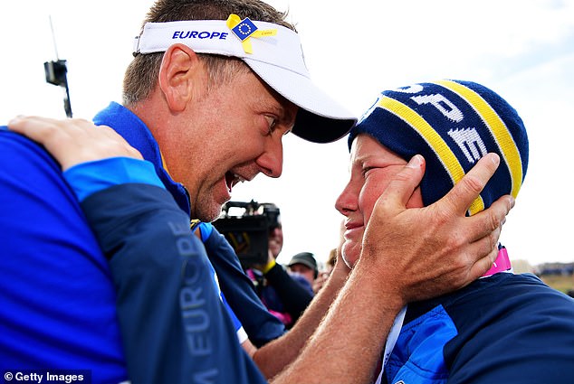 Ian Poulter celebrates helping Europe to win the Ryder Cup in 2018 in France with son Luke