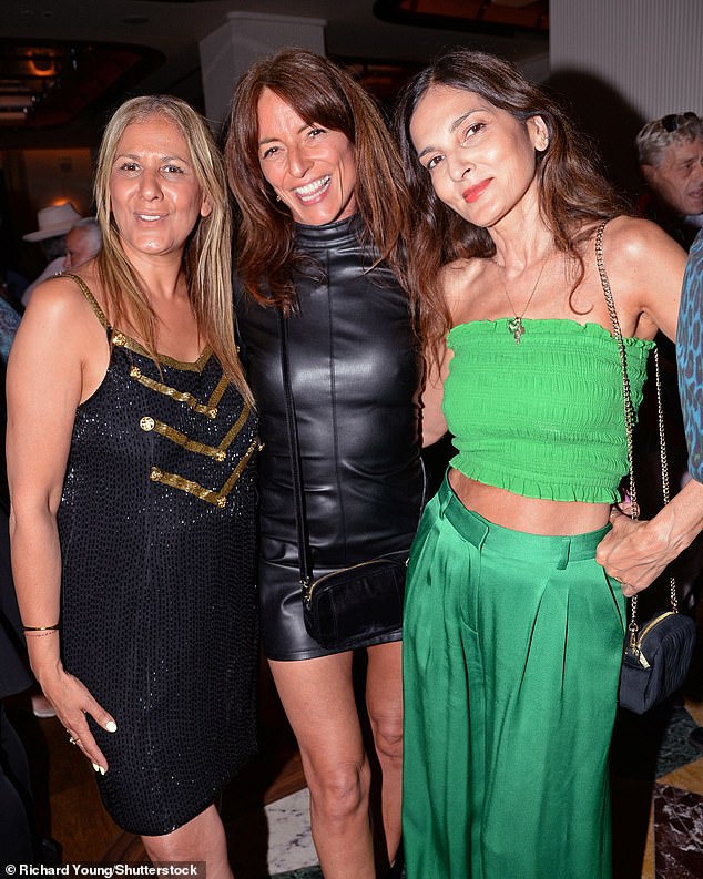 Davina, 57, looked sensational in a black leather mini dress as she made sure to put on a very leggy display in her outfit (pictured with Azzi Glasser and Yasmin Mills)