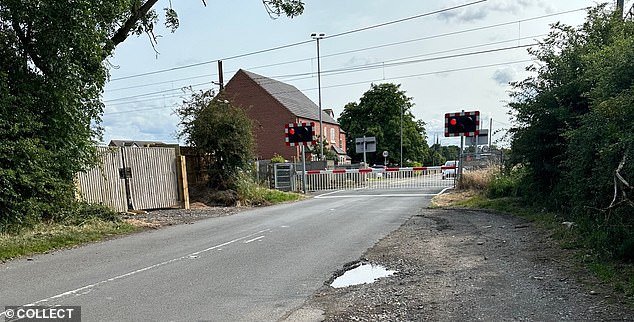 Pictured is the entrance to the new traveller site, which is right next to the level crossing of one of the busiest high-speed railway lines linking London to Leeds