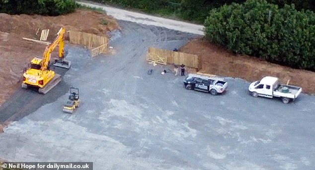 DEVON: When MailOnline this location in Charles on Wednesday, a number of men could be seen working at it, using an industrial excavator to carve away ground and roller to flatten it