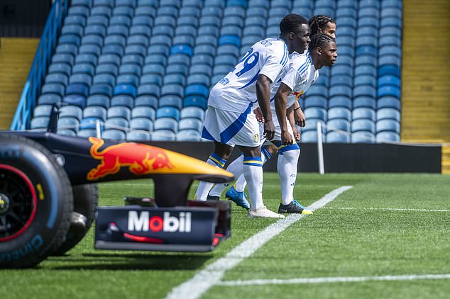 Three Leeds United players raced a Red Bull Formula One car on the Elland Road turf