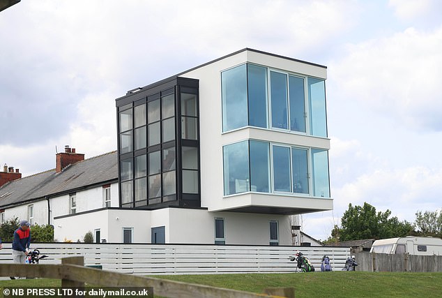 A controversial Grand Designs home has been dubbed 'a glorified greenhouse' by irate neighbours