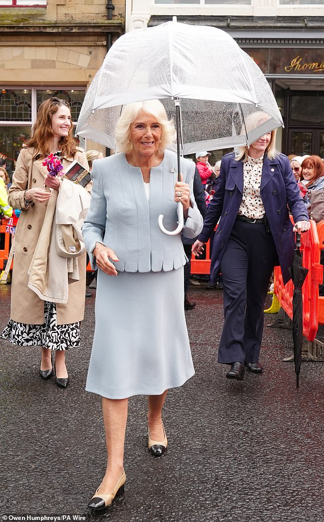The Queen (pictured) has braved the rainy weather to visit what she called 'the most beautiful racecourse' and open a new stand that has been named in her honour last week