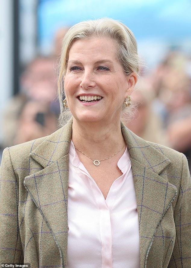 Meanwhile, Sophie was beaming as she waved at crowds, with the Duchess also wearing a greige checked blazer that she paired with a tan, calf-length skirt and a light pink shirt