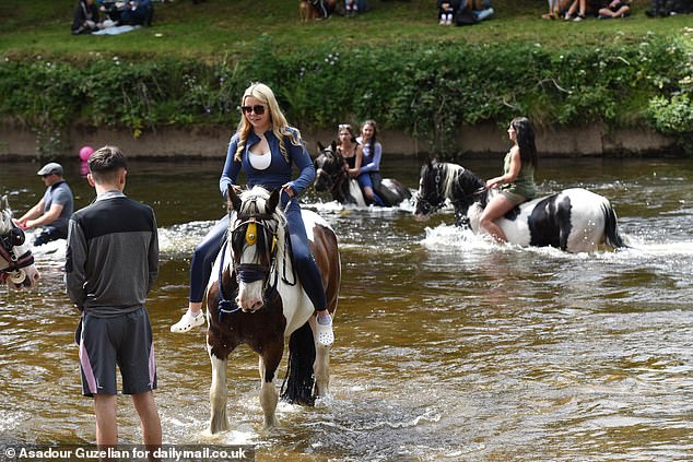 Lily Walker on her horse in the River Eden