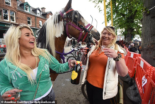 Charlie Mia and Heather Sparkes with Queenie, a county-level show horse on the second day of the Appleby Horse Fair