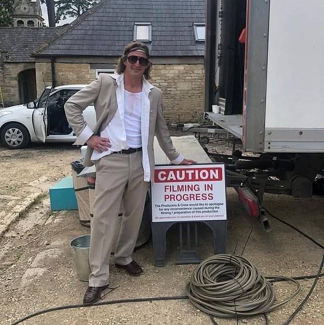TV extra Nigel Adams, 45, was hauled away in handcuffs by six cops in front of shocked cast members. Pictured: Adams working on the set for a show